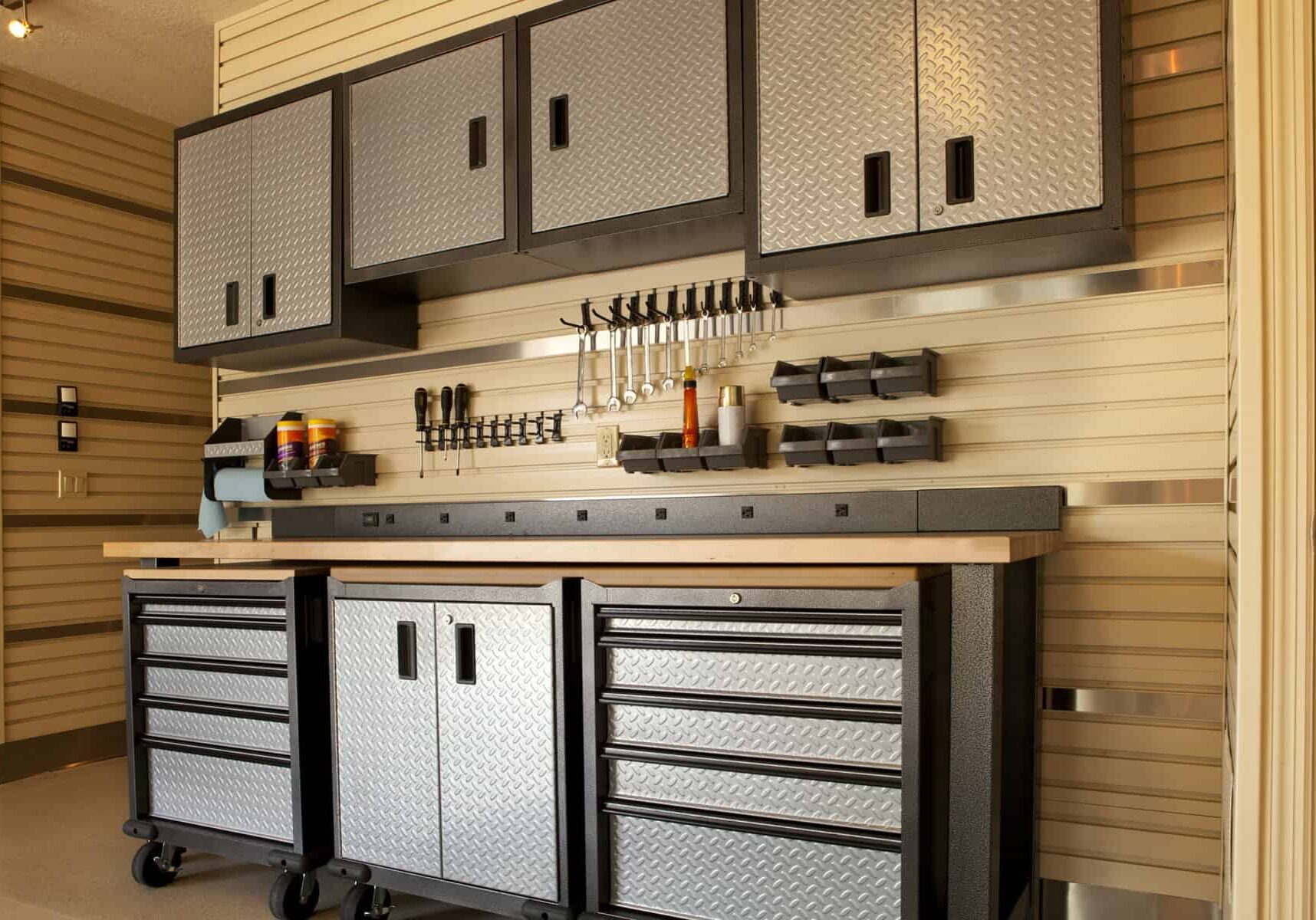 "Garage workspace with cabinets, countertop and tools"